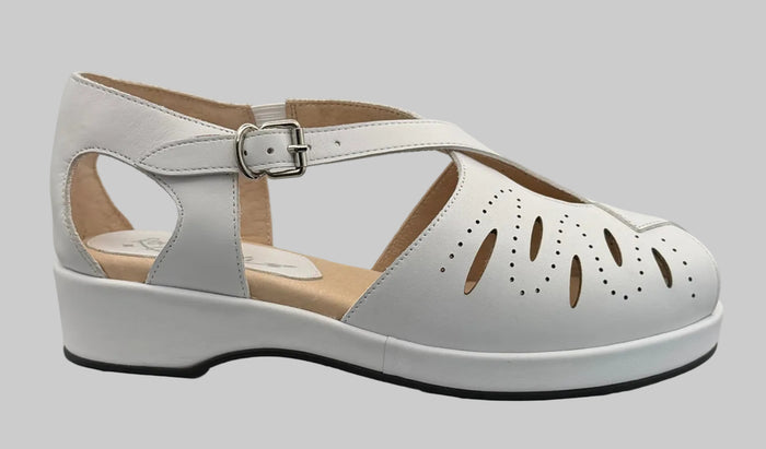 White sandal with cut-out design on a blank background